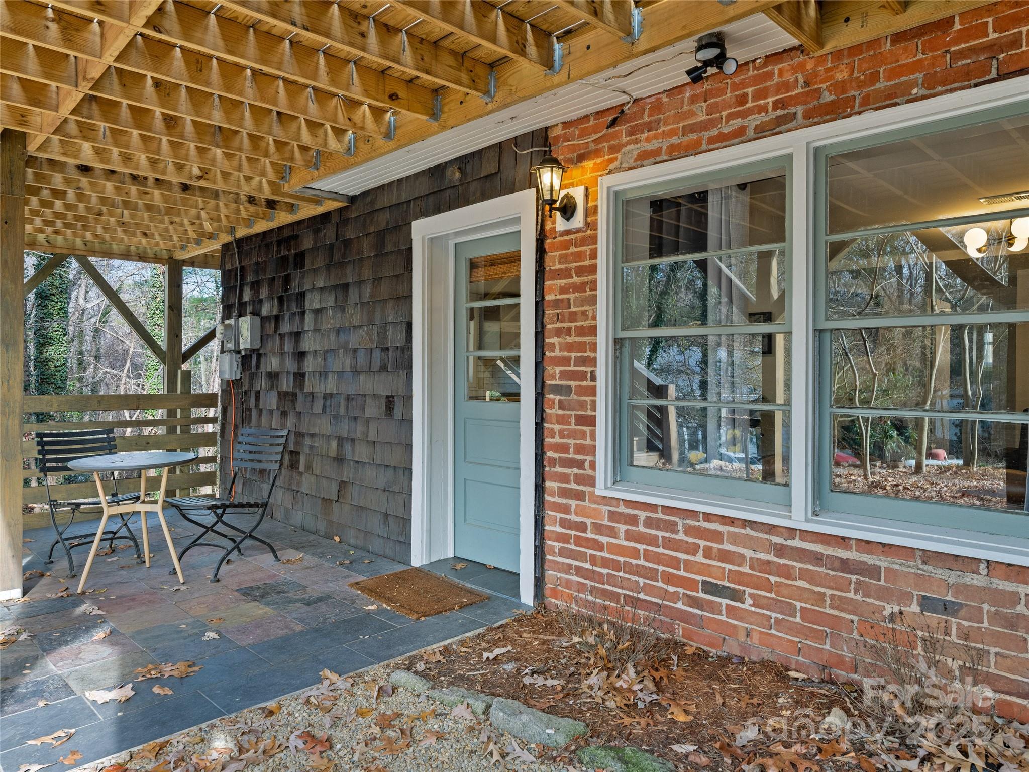 277 Markham Road Tryon, NC 28782 - Photo 26 of 44 a front view of a house with a porch