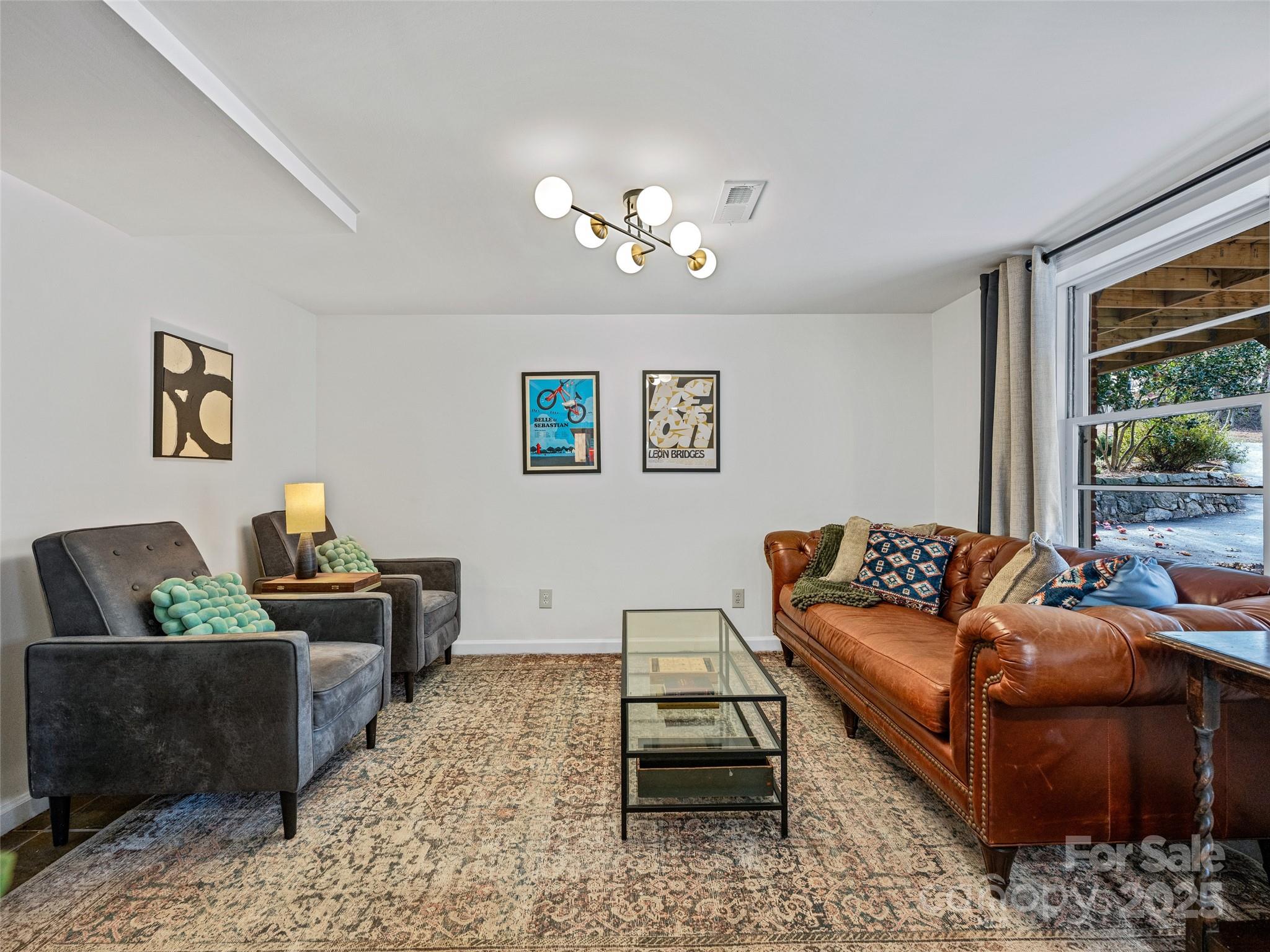 277 Markham Road Tryon, NC 28782 - Photo 27 of 44 a living room with furniture and a window