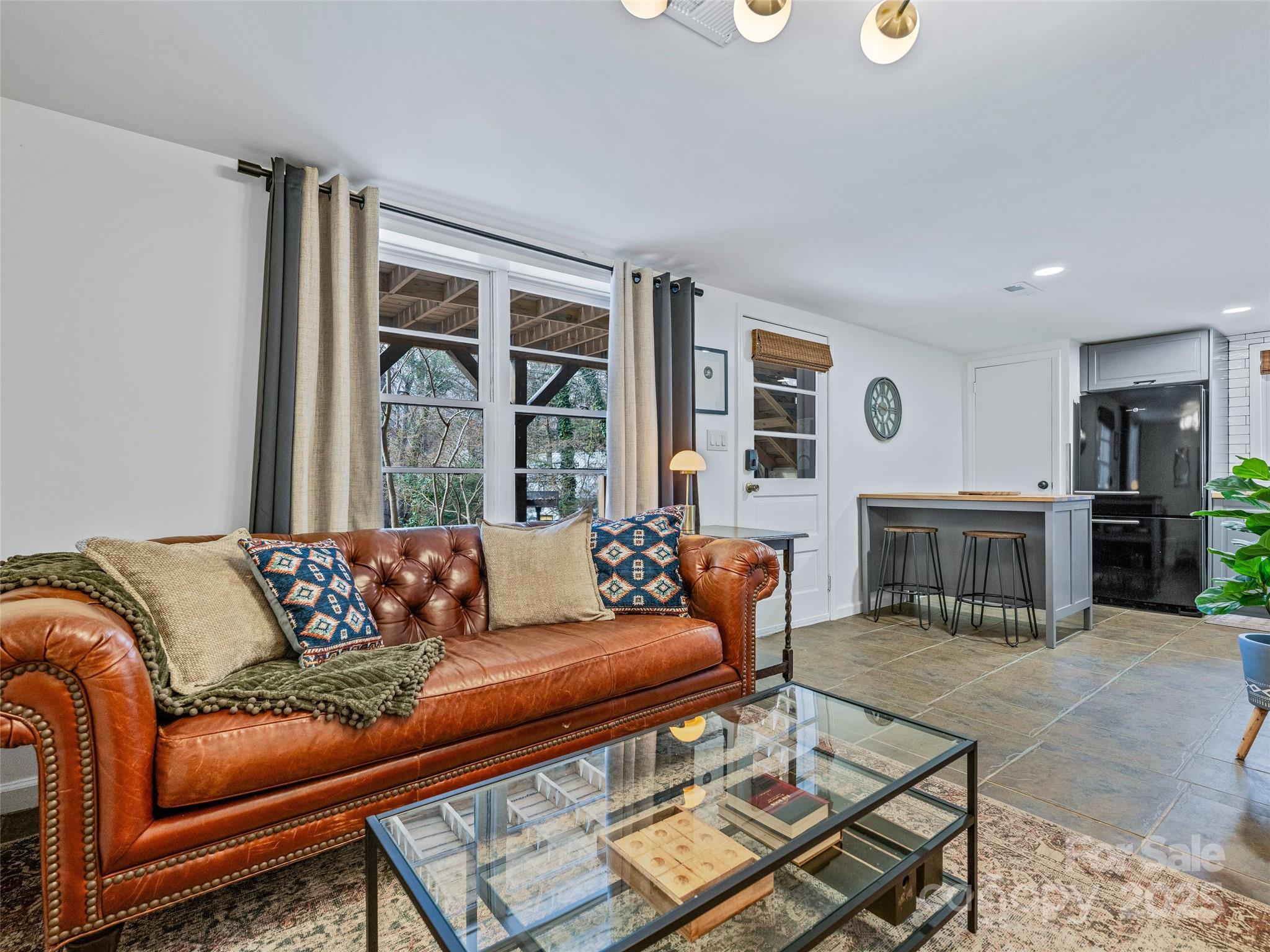 277 Markham Road Tryon, NC 28782 - Photo 29 of 44 a living room with furniture and a window