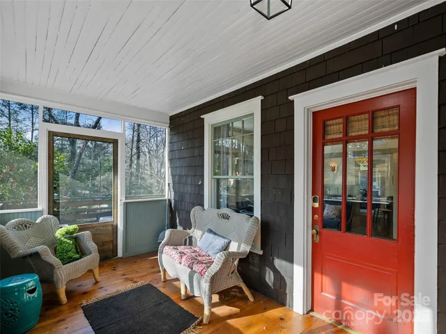 a outdoor living space with furniture and large windows