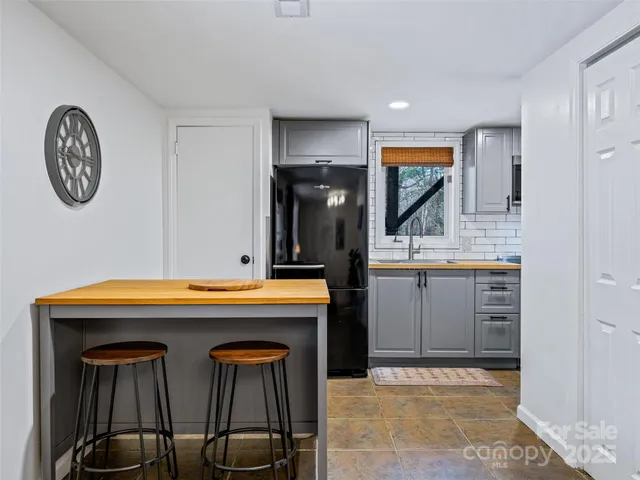 a kitchen with stainless steel appliances a stove sink and microwave