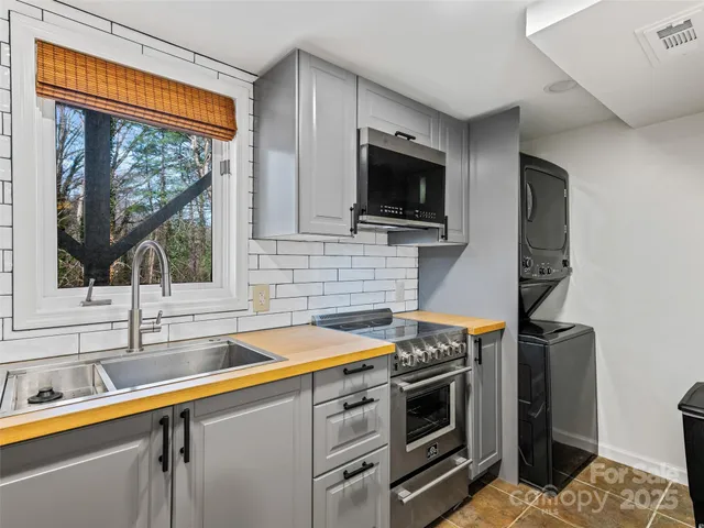 a kitchen with a sink and a microwave