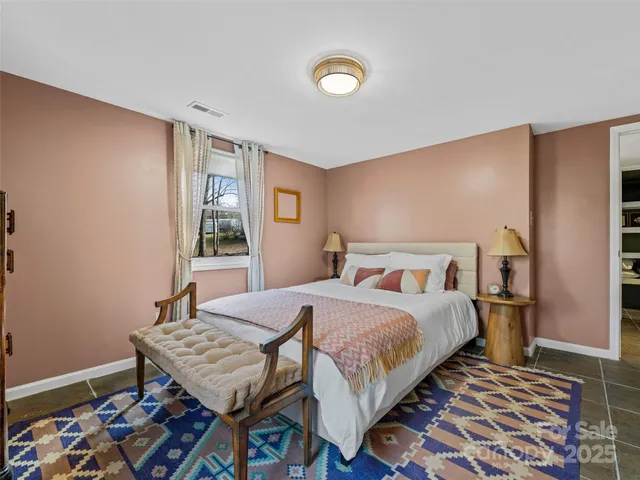 a bedroom with a bed and a table in it