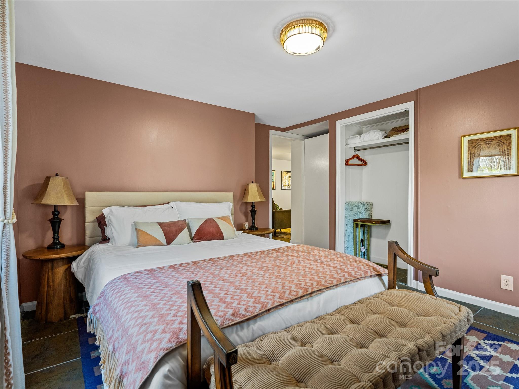 277 Markham Road Tryon, NC 28782 - Photo 36 of 44 a bedroom with a bed and a table in it