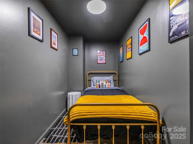 a backyard of a house with barbeque oven table and chairs