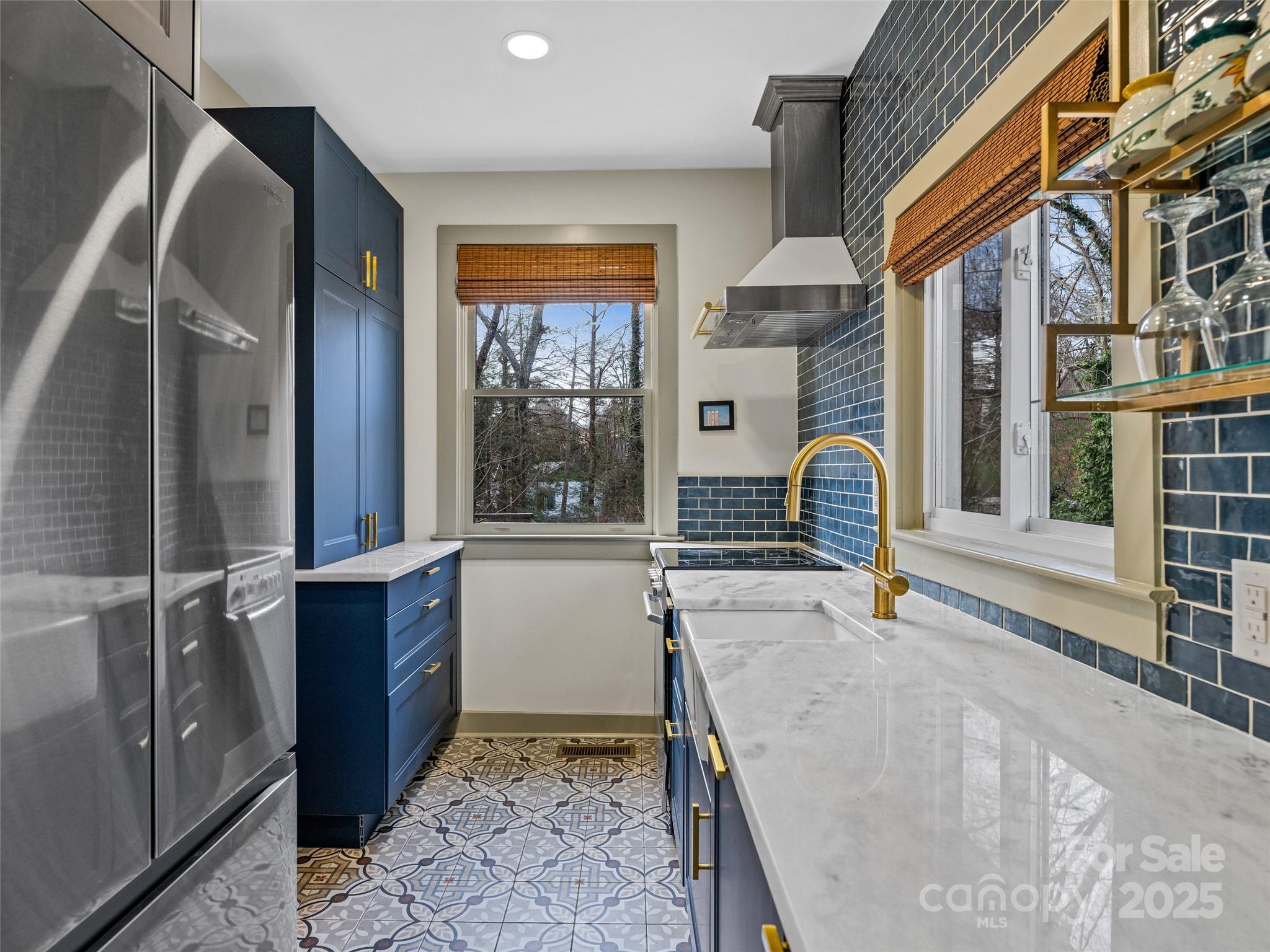 277 Markham Road Tryon, NC 28782 - Photo 6 of 44 a view of a kitchen with a sink and cabinets