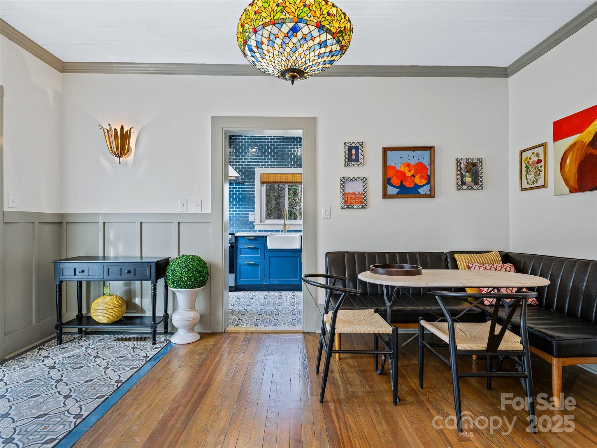 277 Markham Road Tryon, NC 28782 - Photo 7 of 44 a view of a dining room with furniture and wooden floor
