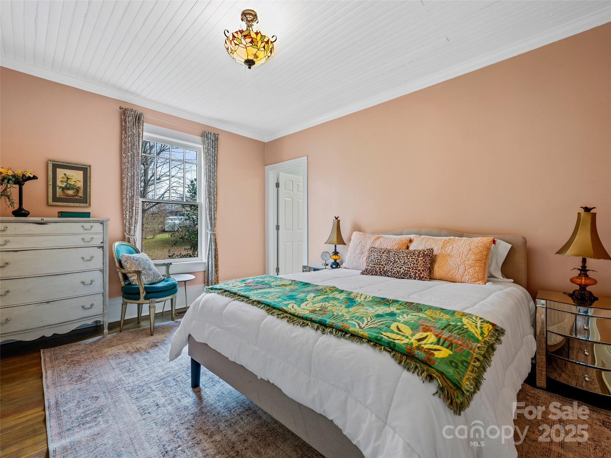 277 Markham Road Tryon, NC 28782 - Photo 8 of 44 a bedroom with a bed and a table