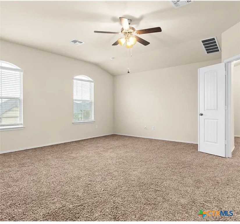 5561 Perdita Drive Belton, TX 76513 - Photo 17 of 24 an empty room with windows and fan
