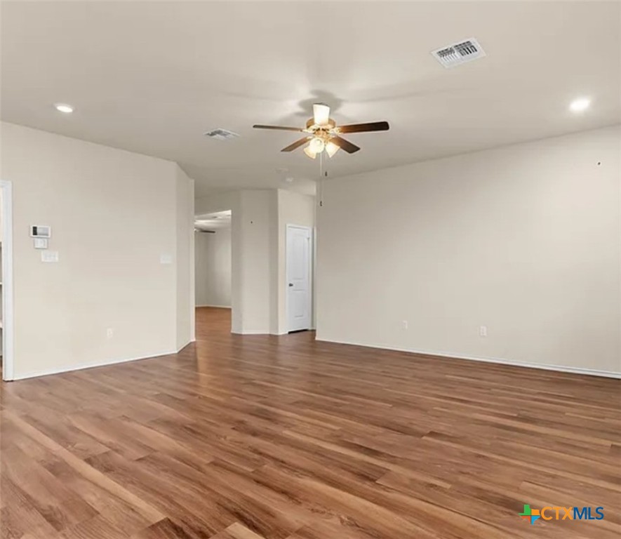 5561 Perdita Drive Belton, TX 76513 - Photo 6 of 24 a view of empty room with wooden floor and fan