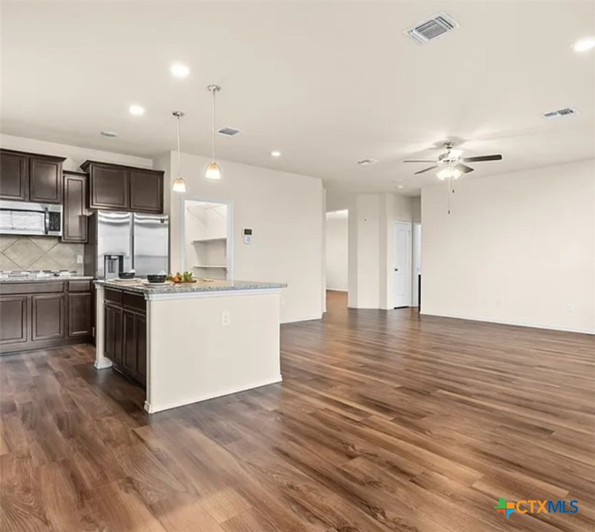 5561 Perdita Drive Belton, TX 76513 - Photo 9 of 24 a view of kitchen with cabinets microwave and stove