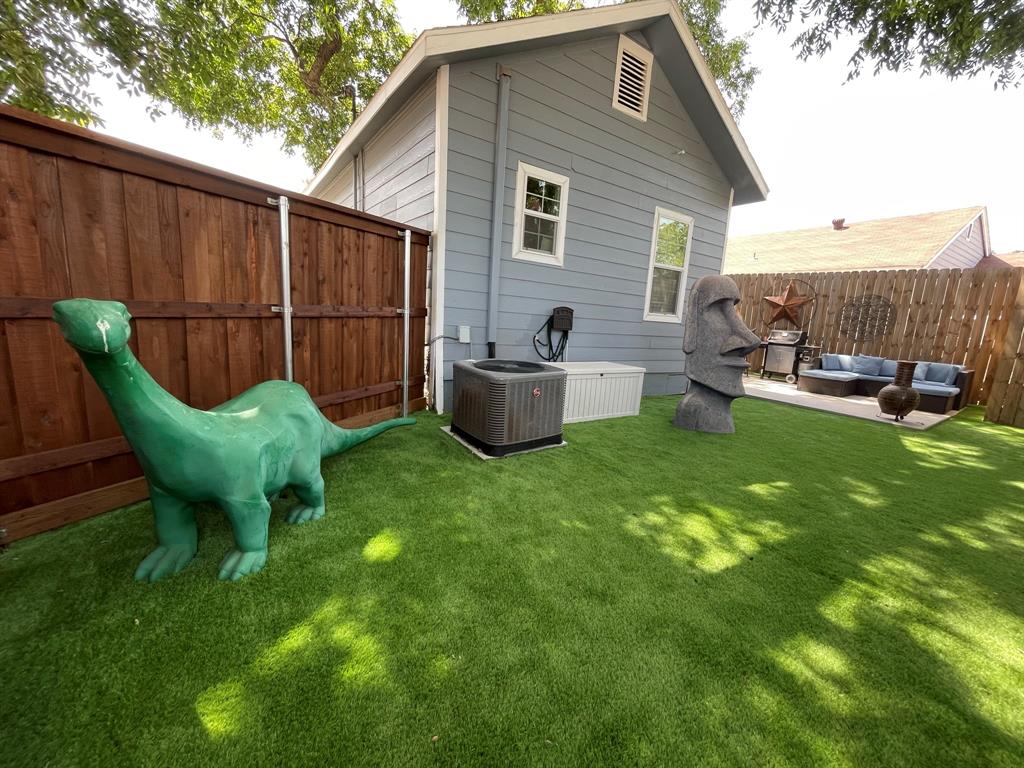 702 North Tennessee Street McKinney, TX 75069 - Photo 3 of 10 a view of a backyard with table and chairs