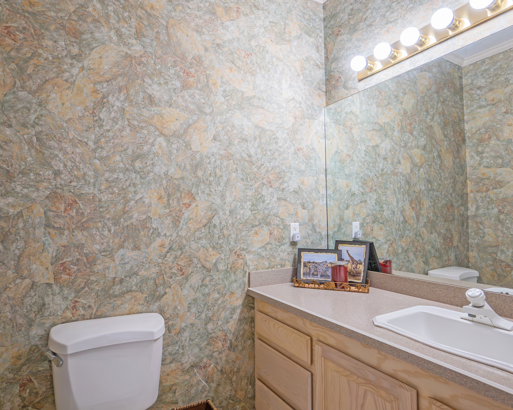 214 Williams Road Bay City, TX 77414 - Photo 38 of 48 a bathroom with a toilet sink and mirror