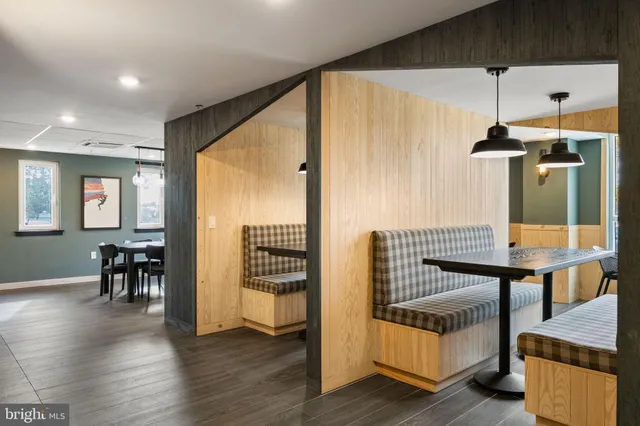 a view of living room with furniture and wooden floor