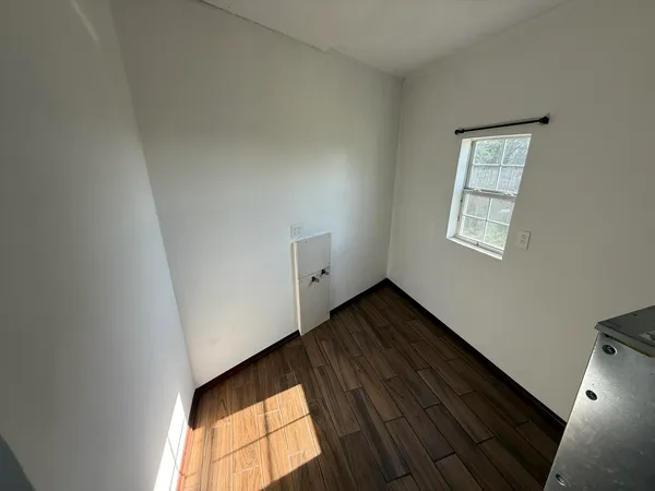 a view of an empty room and window