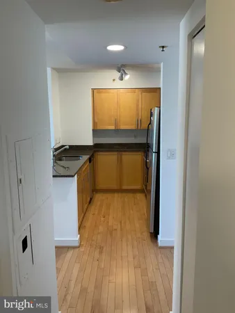 a view of kitchen and wooden floor