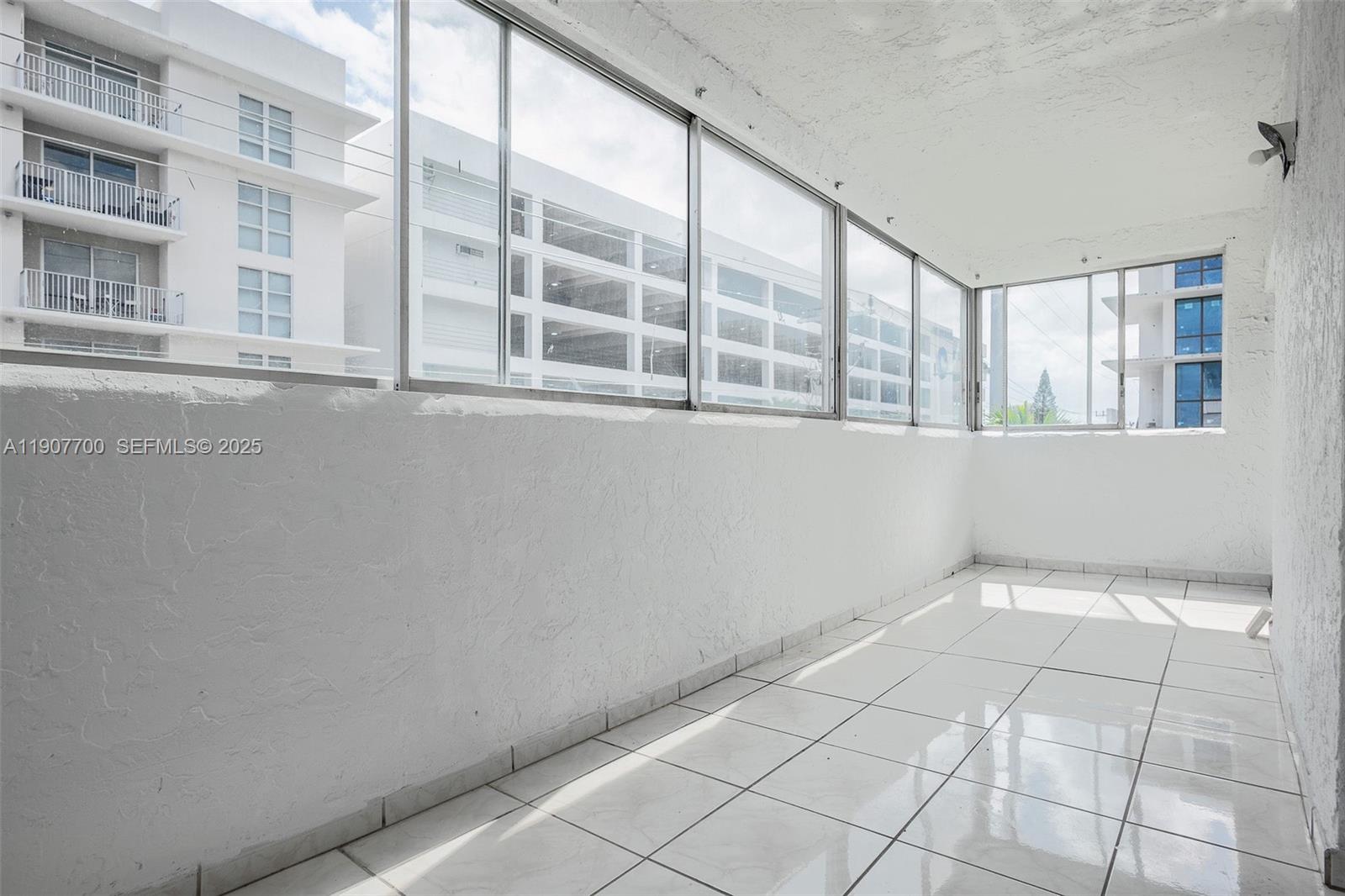 750 Northwest 43rd Avenue, Unit 308 Miami, FL 33126 - Photo 17 of 31 a view of an empty room with a window