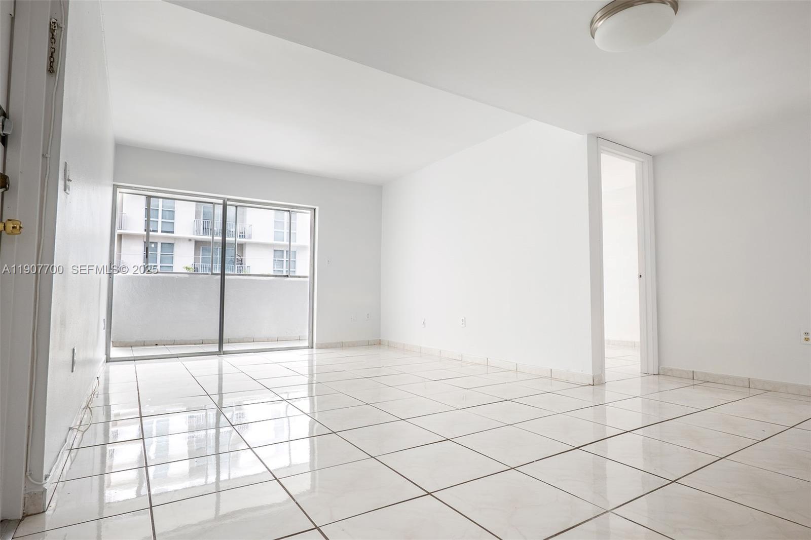 750 Northwest 43rd Avenue, Unit 308 Miami, FL 33126 - Photo 20 of 31 a view of an empty room and window