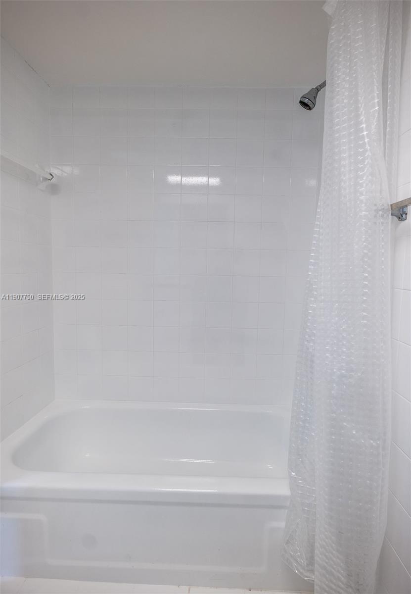 750 Northwest 43rd Avenue, Unit 308 Miami, FL 33126 - Photo 25 of 31 a close up of a bathtub