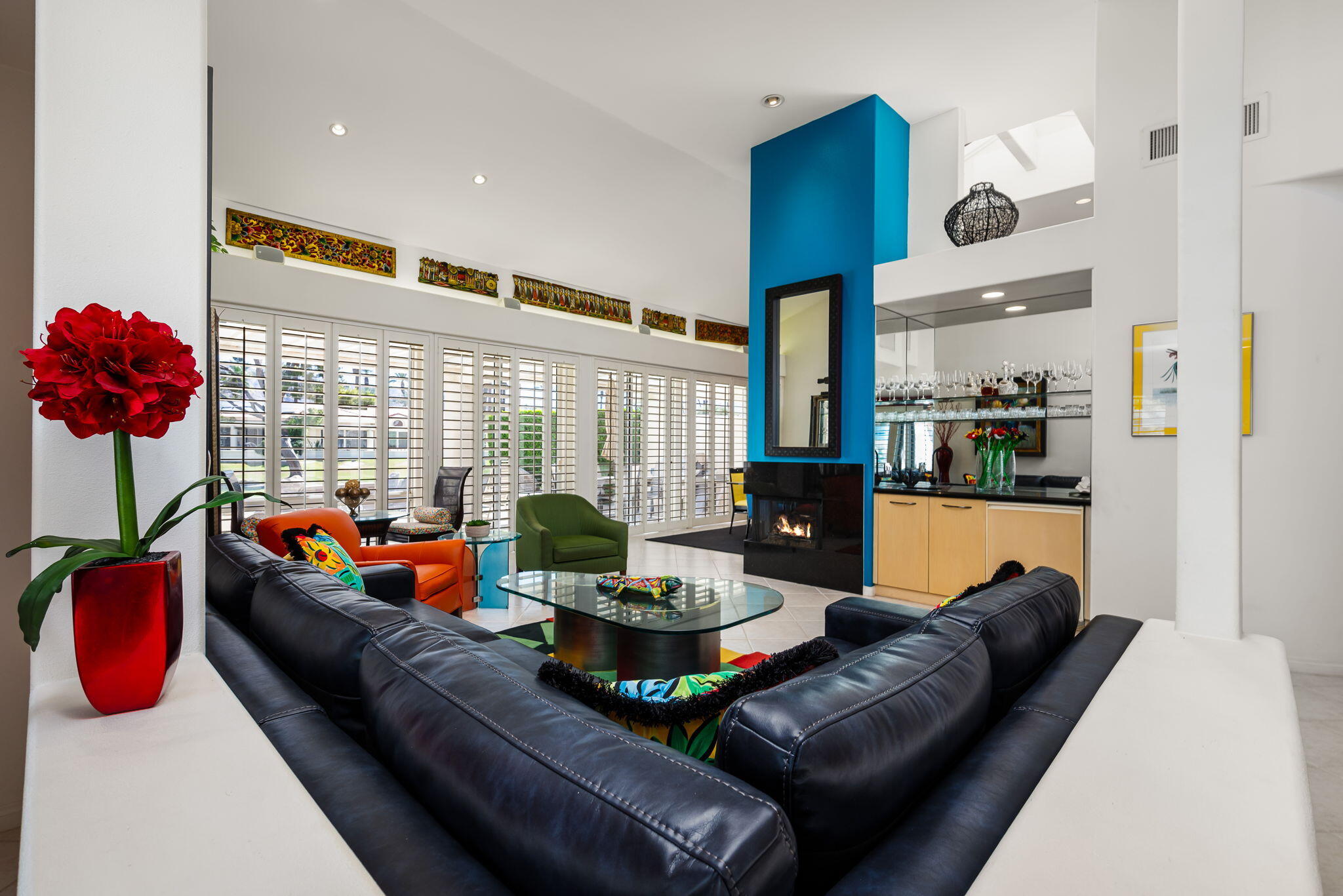 75395 Riviera Drive Indian Wells, CA 92210 - Photo 13 of 35 a living room with furniture kitchen and a floor to ceiling window