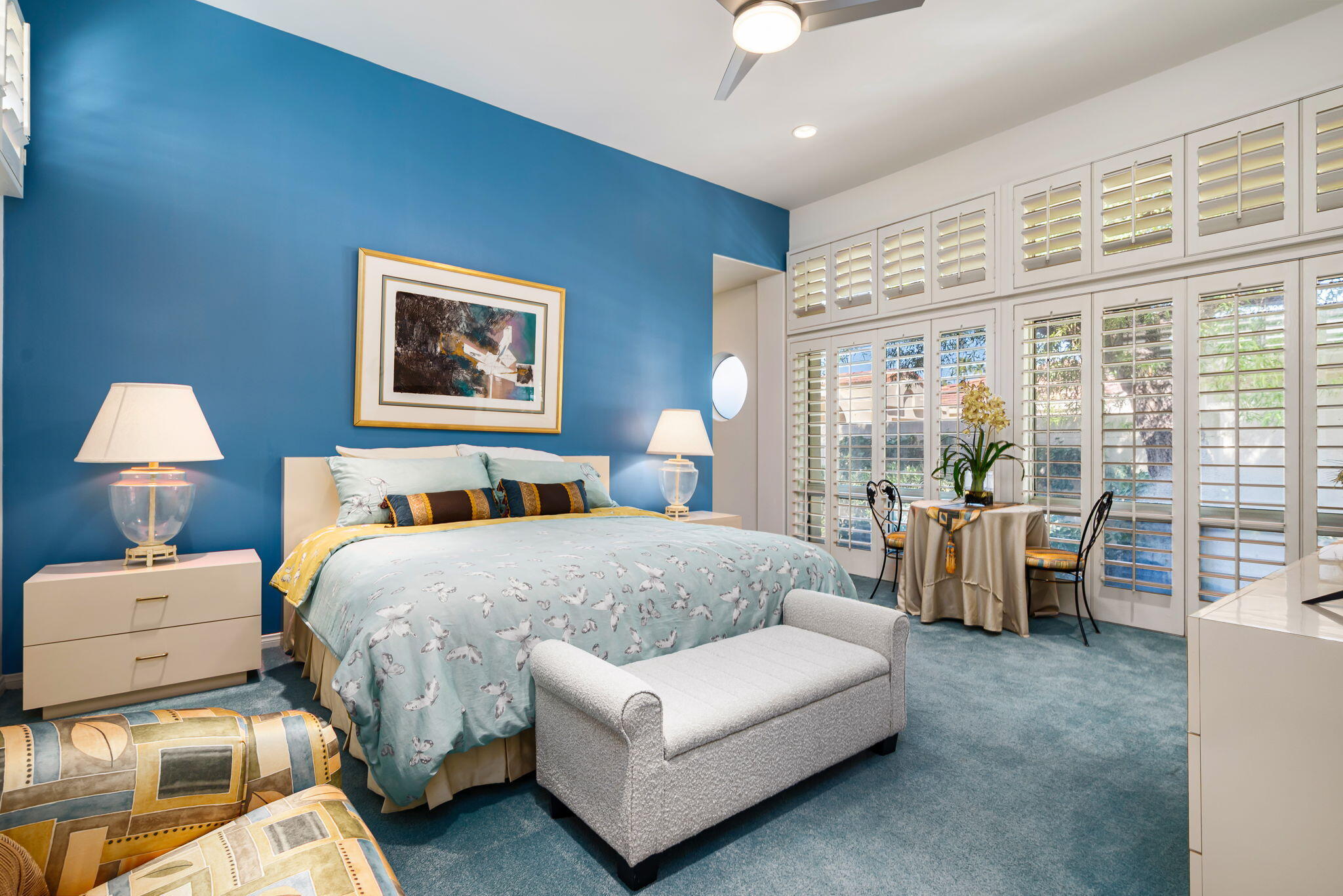 75395 Riviera Drive Indian Wells, CA 92210 - Photo 19 of 35 a spacious bedroom with a bed and glass walk in closet