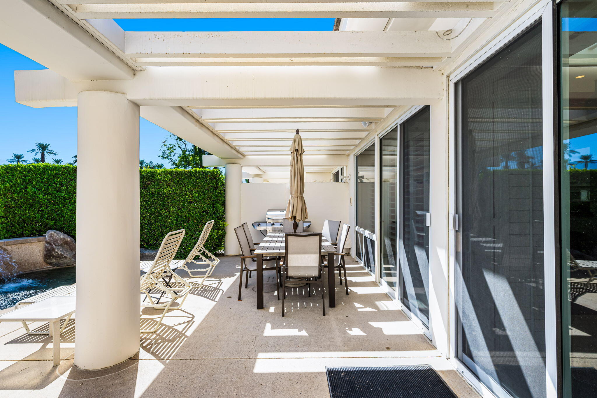 75395 Riviera Drive Indian Wells, CA 92210 - Photo 29 of 35 a dining room with furniture and floor to ceiling windows