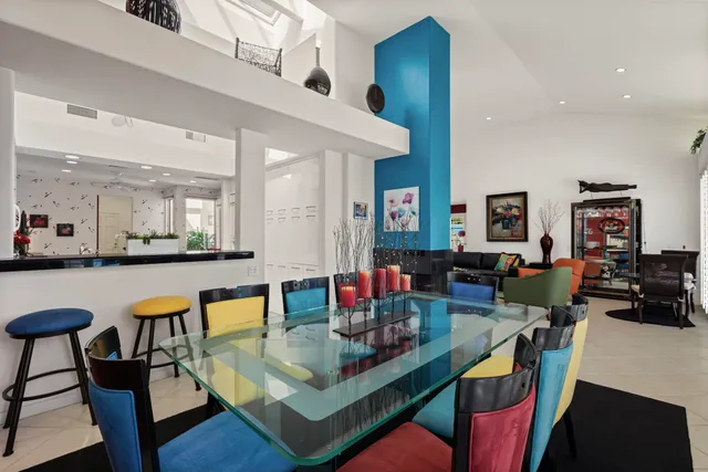 a bedroom with bed and a large window