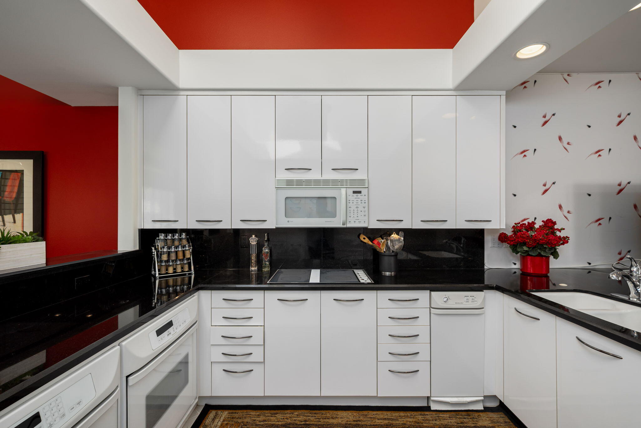 75395 Riviera Drive Indian Wells, CA 92210 - Photo 10 of 35 a kitchen with white cabinets and sink