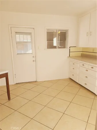 a view of a house with a yard and a garage