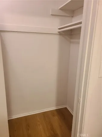 a kitchen with granite countertop a sink stainless steel appliances and cabinets