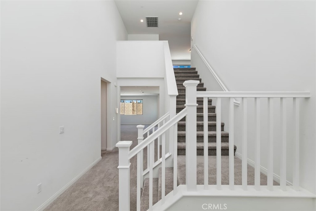 4521 Highland Avenue Perris, CA 92571 - Photo 12 of 54 a view of staircase with white walls and a window