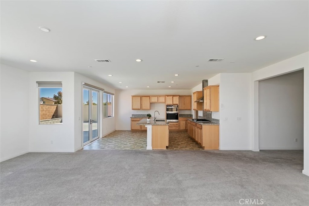 4521 Highland Avenue Perris, CA 92571 - Photo 15 of 54 a view of a kitchen with a sink and cabinets