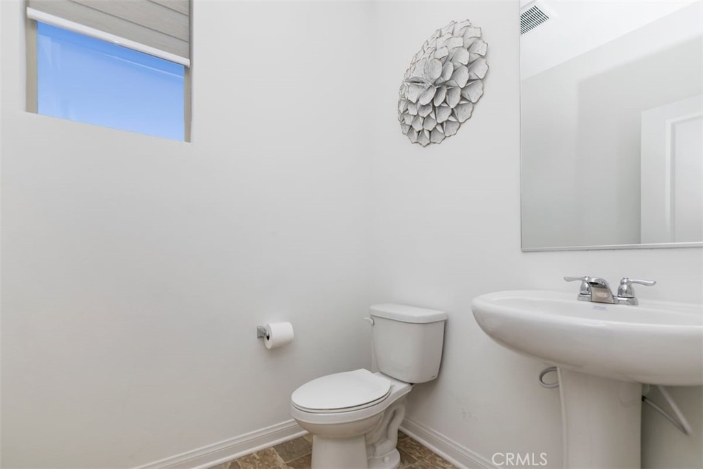 4521 Highland Avenue Perris, CA 92571 - Photo 23 of 54 a bathroom with a sink and a toilet