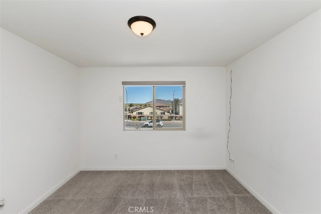 4521 Highland Avenue Perris, CA 92571 - Photo 28 of 54 an empty room with a window