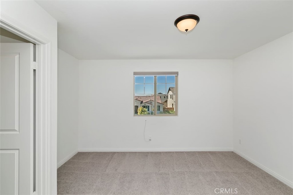 4521 Highland Avenue Perris, CA 92571 - Photo 30 of 54 a view of a room with a fan and a window