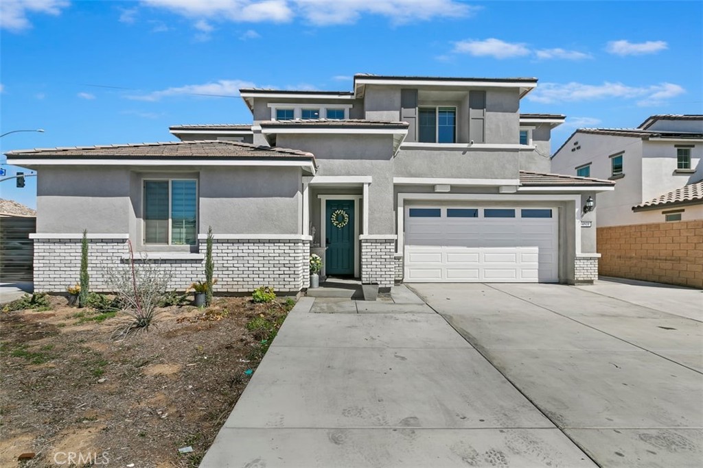 4521 Highland Avenue Perris, CA 92571 - Photo 3 of 54 front view of a house with a street