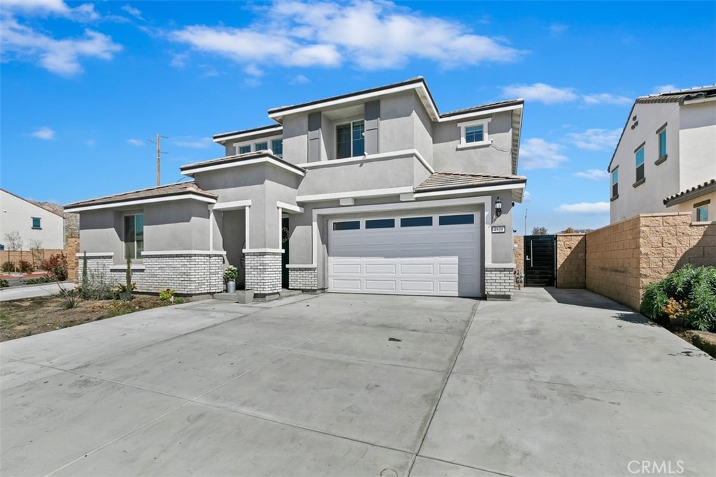 4521 Highland Avenue Perris, CA 92571 - Photo 8 of 54 front view of a house with a street