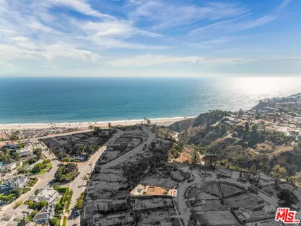 an aerial view of beach and city