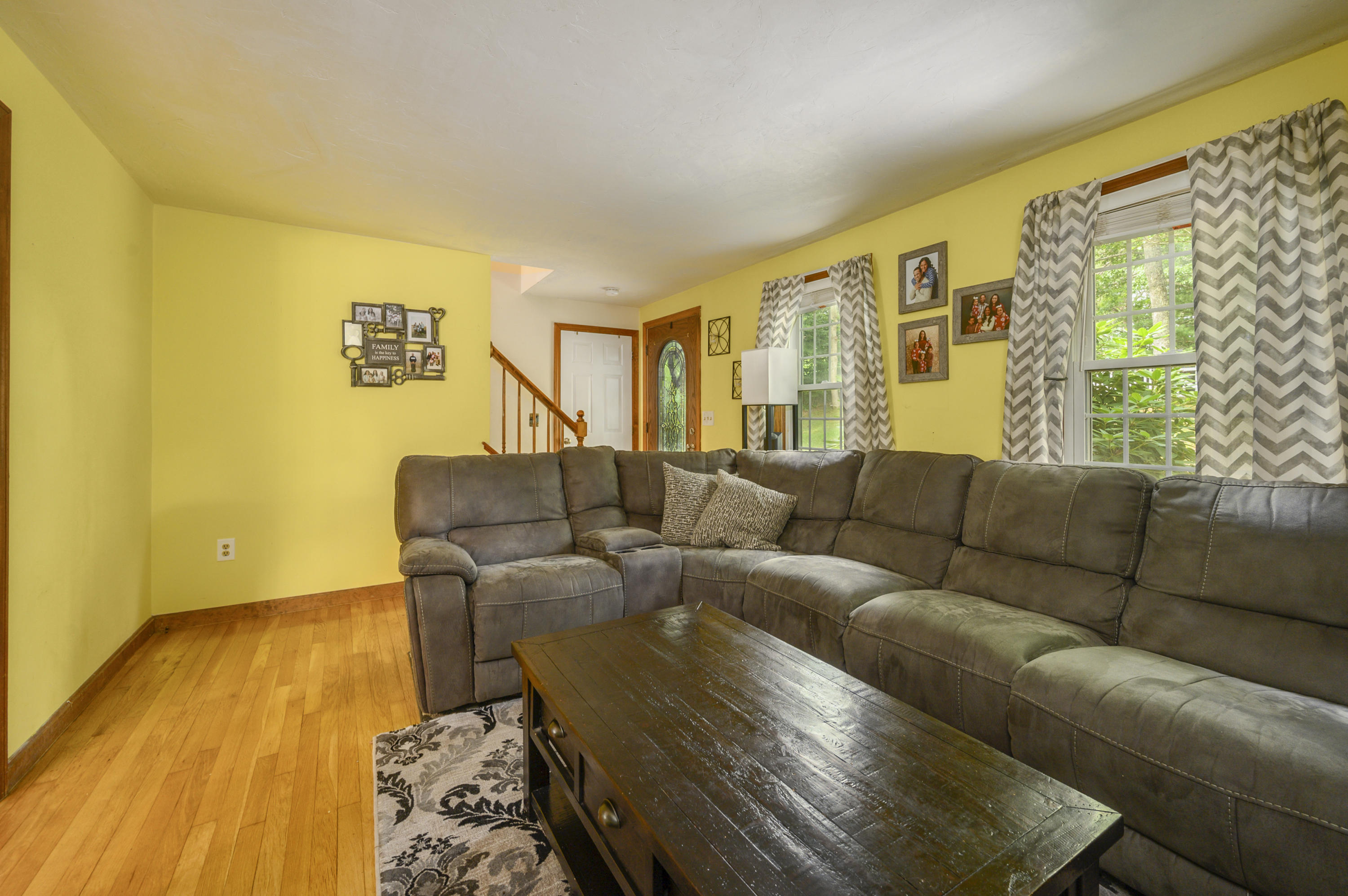 27 Oregon Road Mashpee, MA 02649 - Photo 7 of 17 a living room with furniture and a large window