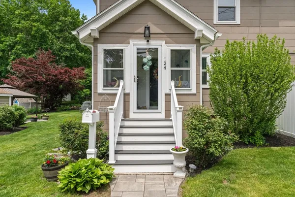a front view of a house with a yard