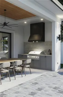 a kitchen with a table chairs and a sink
