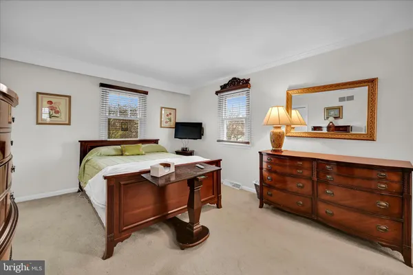 a bed room with a bed and a dresser