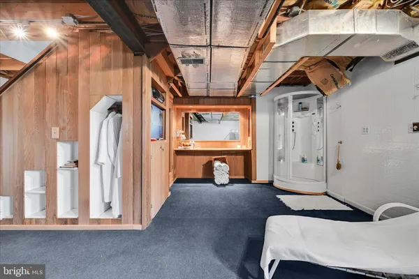 a view of a room with wooden furniture