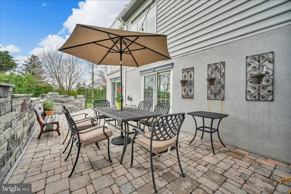 a view of a chairs and table in the patio