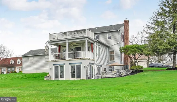 a big house with a big yard and more windows