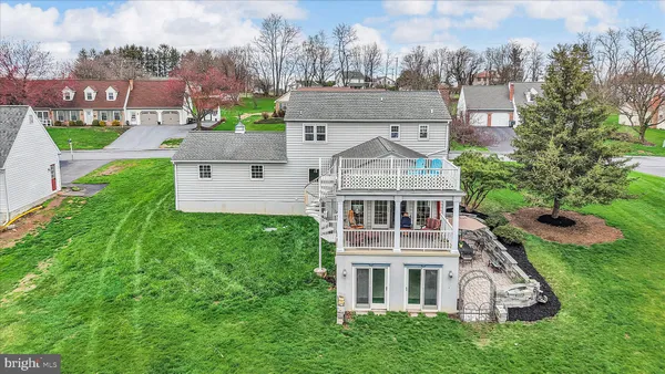 an aerial view of residential houses with outdoor space and street view