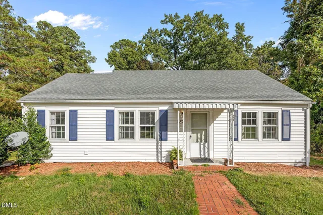 a backyard of a house with seating space