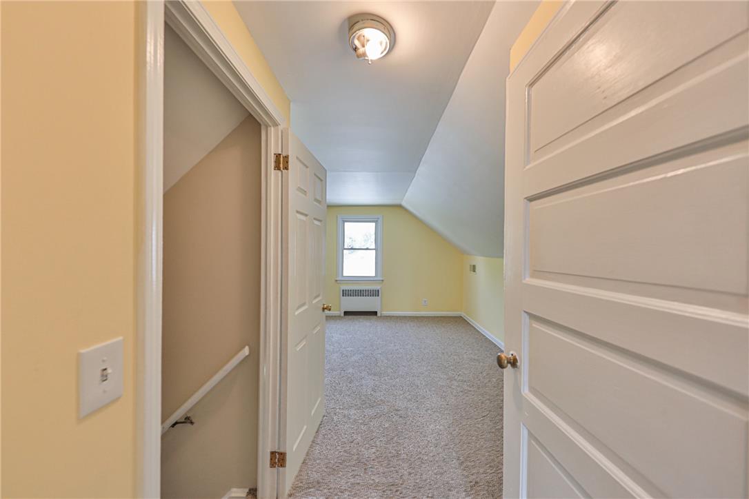 3050 Cornwall Road Bethlehem, PA 18017 - Photo 41 of 80 A well-lit bedroom with sloped ceilings and plush carpet offers cozy, inviting living space.