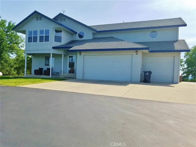a view of a house with swimming pool and porch