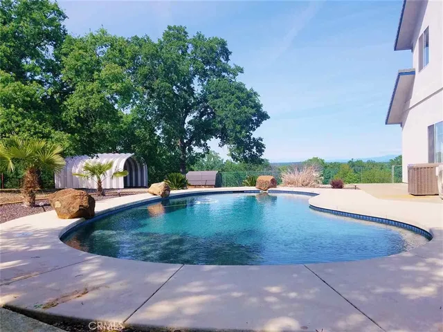 a view of a swimming pool with a sitting space